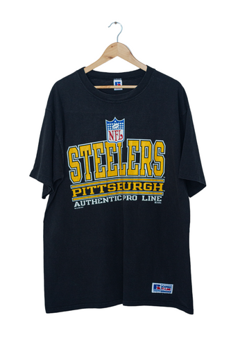 Black Faded Pittsburgh Steelers Russell Athletic Vintage T-Shirt with Big Spell Out Team Graphic - Authentic NFL Apparel in Retro Style, Perfect for Steelers Fans | Limited Edition Collector's Item